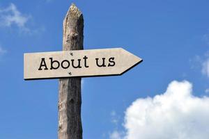 About Us - Wooden Signpost with one Arrow, Sky with Clouds photo