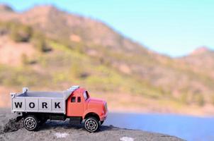 Toy truck on a rock photo