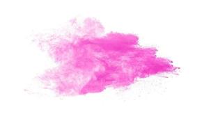 Pink dust particles explosion on wite background.Freeze motion of pink powder splash. photo