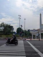 a zebra crossing for pedestrians to cross the road in Surabaya, Indonesia photo