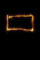 Square made with sparklers ready for your inscriptions on black background photo