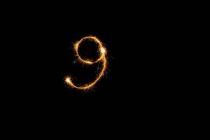 Number made with sparklers ready for your inscriptions on black background photo