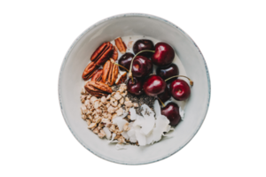White plate with cherries nuts, aotmeal and coconut slices isolated on a transparent background png