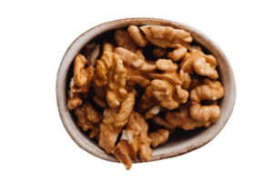 marrón nueces en un cuenco aislado en un transparente antecedentes png