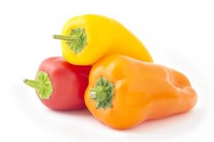 three mini sweet peppers isolated on white photo