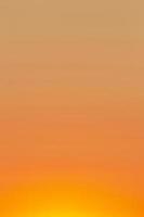 clear orange sky at sunset photo