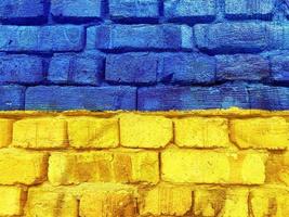 bright Ukrainian flag painted on brick wall photo