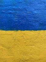 Ukrainian national flag painted on wall photo