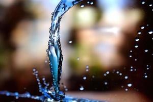 falling liquid on the floor, water splash and blurred background photo