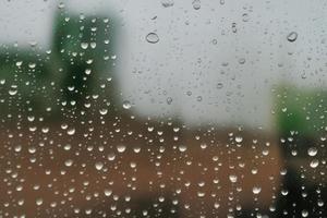 small water drop on the glass window, minimalistic design backdrop with copy space photo