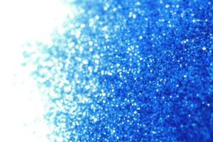 blue background with gradient, bokeh and sparkles on blue background photo