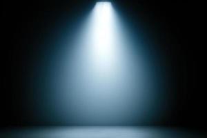 spotlight in dark room, smoke on the floor background, blue backdrop photo
