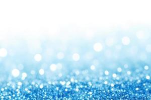 blue background with gradient, bokeh and sparkles on blue background photo