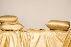 gold cloth on table golden pillow on fabric, product mockup photo