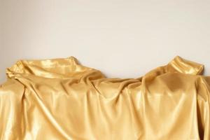 gold cloth on table golden pillow on fabric, product mockup photo