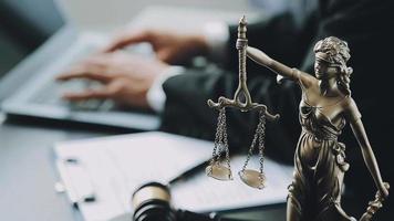 Male lawyer working with contract papers and wooden gavel on tabel in courtroom. justice and law ,attorney, court judge, concept. video