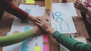 Financial analysts analyze business financial reports on a digital tablet planning investment project during a discussion at a meeting of corporate showing the results of their successful teamwork. video