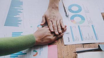 Group of confident business people point to graphs and charts to analyze market data, balance sheet, account, net profit to plan new sales strategies to increase production capacity. video