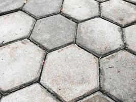 paving blocks that are installed neatly and regularly on the ground so that the roads are not muddy because of water or when it rains photo