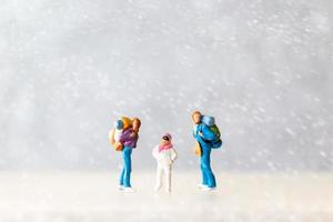 Miniature people Happy family Travel in winter time photo