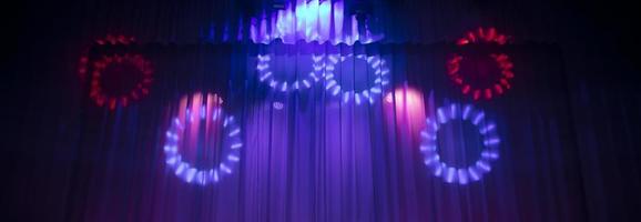 Baner theatrical curtain in the rays of the stage spotlight. photo