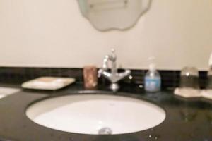 Abstract blur white sink and faucet bathroom interior background photo