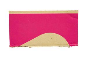 Brown and pink cardboard paper piece isolated on white background photo