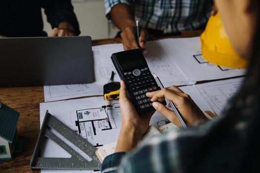 Construction and structure concept of engineer working drawing on blueprint meeting for project working with partner on model building and engineering tools in working site, construction concept photo