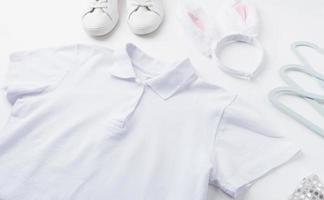 white polo shirt and bunny ears for mockup design photo