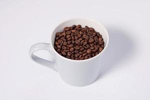 mug of coffee beans - horizontal photo on white background