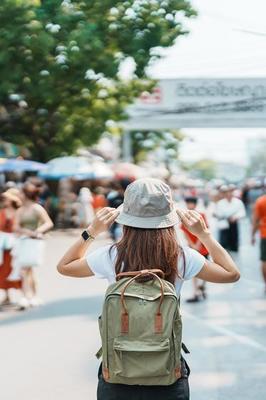 woman traveler visiting in Bangkok, Tourist with backpack and hat  sightseeing in Chatuchak Weekend Market, landmark and popular attractions  in Bangkok, Thailand. Travel in Southeast Asia concept 21601287 Stock Photo  at Vecteezy