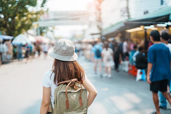 woman traveler visiting in Bangkok, Tourist with backpack and hat  sightseeing in Chatuchak Weekend Market, landmark and popular attractions  in Bangkok, Thailand. Travel in Southeast Asia concept 21601287 Stock Photo  at Vecteezy