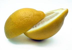 A slice of yellow lemon isolated in white background photo