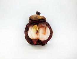 Peeled rotten mangosteen isolated on white background photo