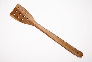 Wooden spatula isolated in white background photo