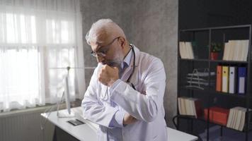 Elderly doctor is thoughtful about patients and looking for solutions. The thoughtful senior doctor has many problems on his mind. video