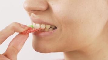 Close-up of woman eating watermelon jelly. Close-up portrait of woman eating watermelon jelly. video