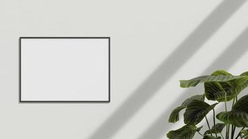 Blank poster frame on the wall with plant. Blank poster frame mockup. Empty picture frame mockup. Blank photo frame