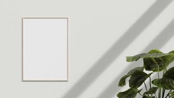 Blank poster frame on the wall with plant. Blank poster frame mockup. Empty picture frame mockup. Blank photo frame