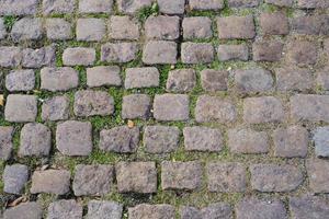 Old stone paving stones, road surface. photo