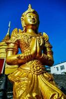 Buddhist sculptures at a temple in Bangkok, Thailand photo