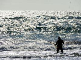 Kitesurfer at sunset photo