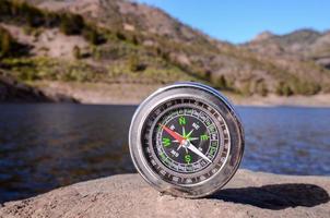 Compass on a rock photo