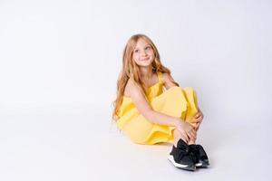 Fashion Studio Teen Style Style in shoes. Fashionable young girl wears summer photo