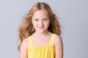 Portrait happy tender teenager girl with blue eyes and freckles, looking photo