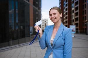 Business woman holding badge in hand photo