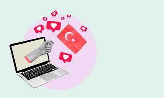 Art collage, the hand with the Turkish flag from a laptop with hearts and barks on a light background. photo