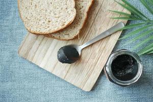 Black sesame spread on a bread photo