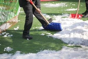 men using Red blurry snow shovel. photo