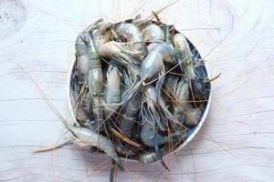 close up of raw king prawn on table. photo